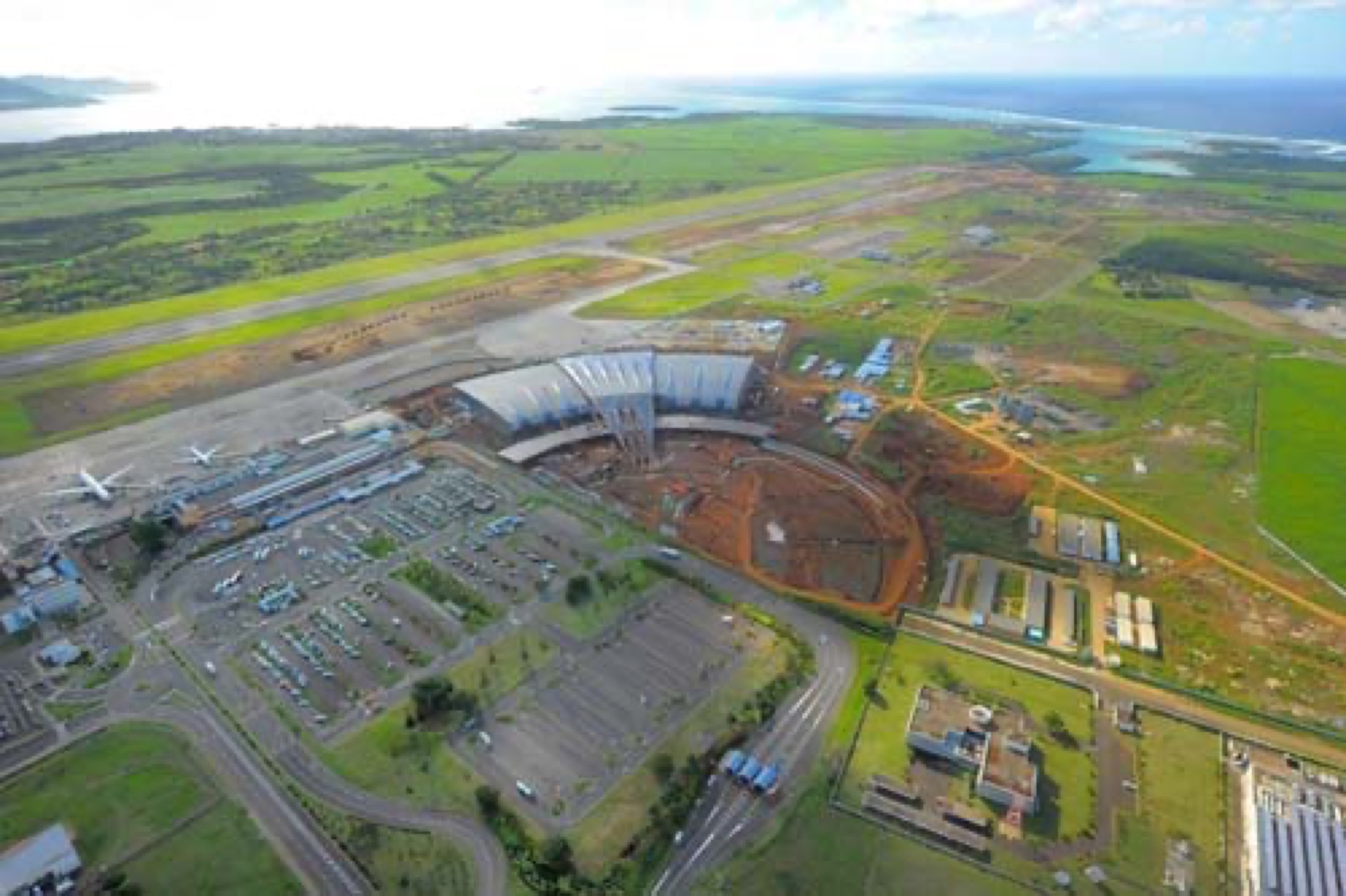 International airport terminal under construction, aerial